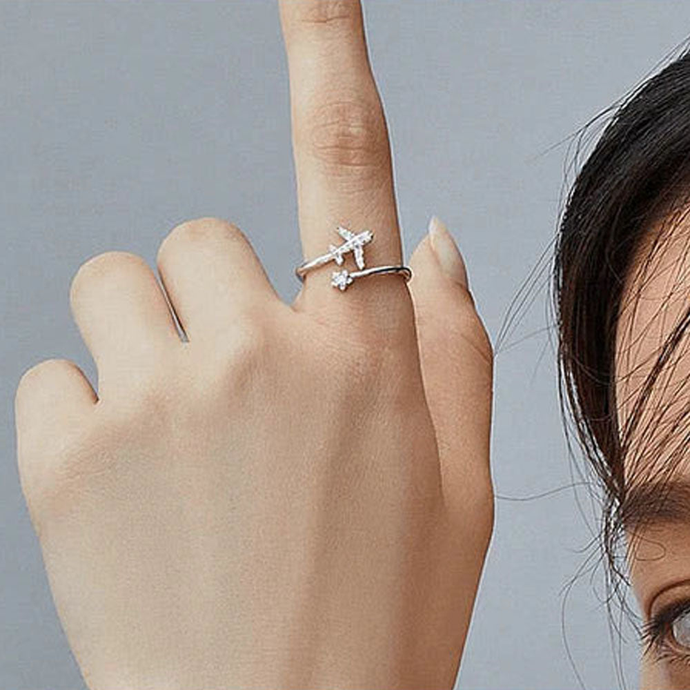 silver adjustable ring on a womans finger