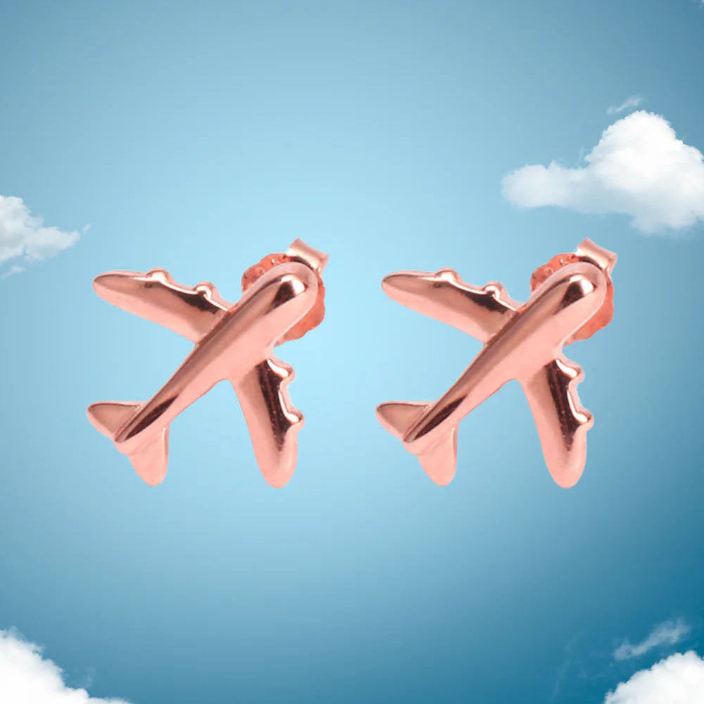 pair of airplane earrings in rose gold